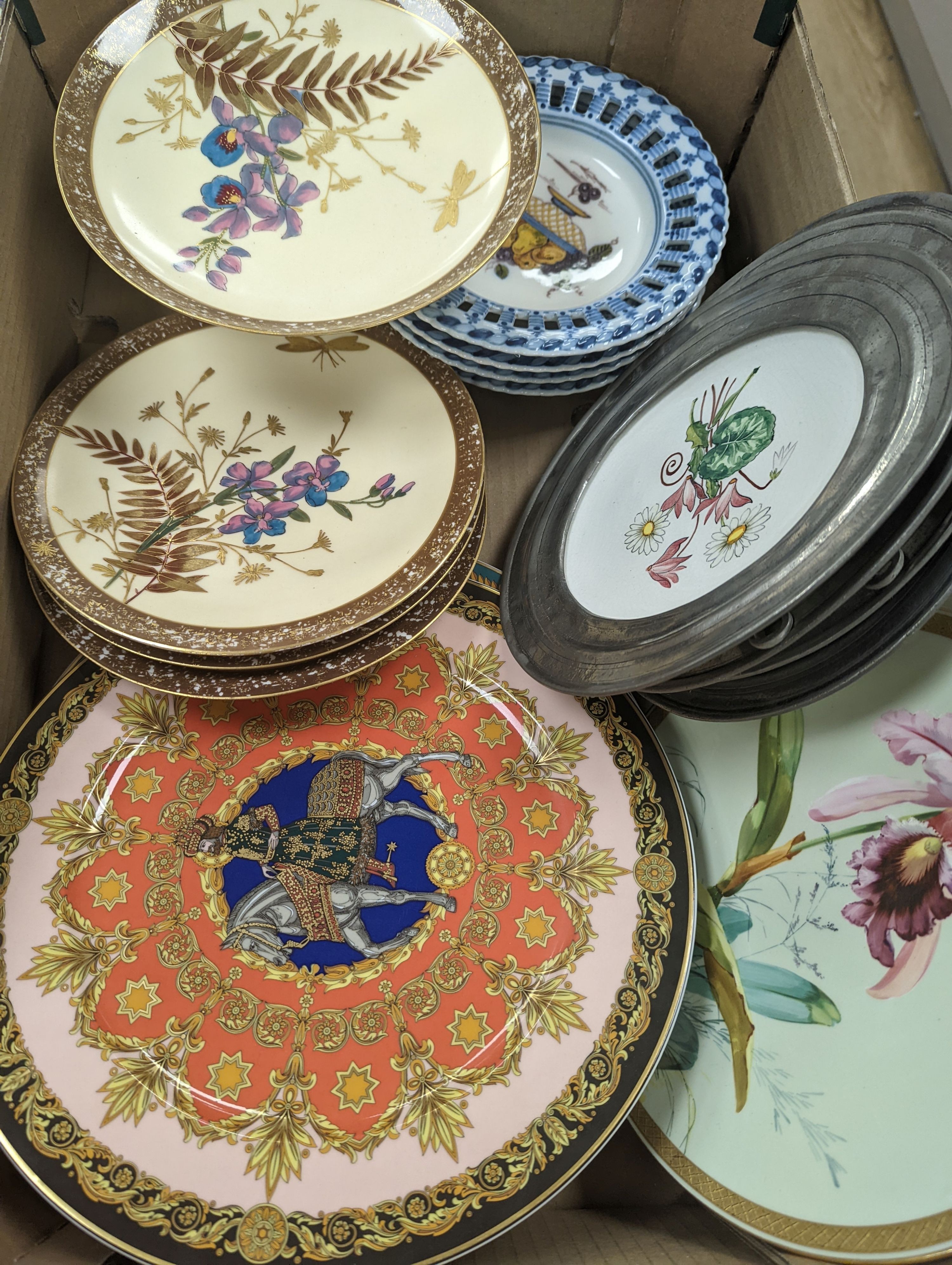 A collection of French pewter and ceramic plates, a set of Dutch fruit plates and a 2 part dessert service, large Rosenthal studioline Versace plates